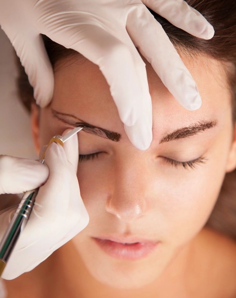 Patient getting Microblading on eyebrow