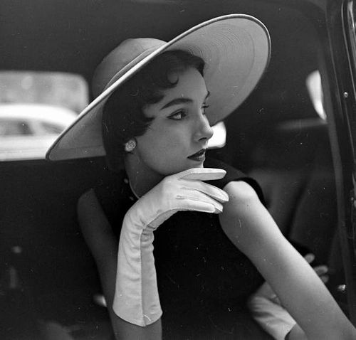 Spring Hats #2, LIFE Photo Store. Lovely long-limbed brunette model in back of car. Toni Breland log