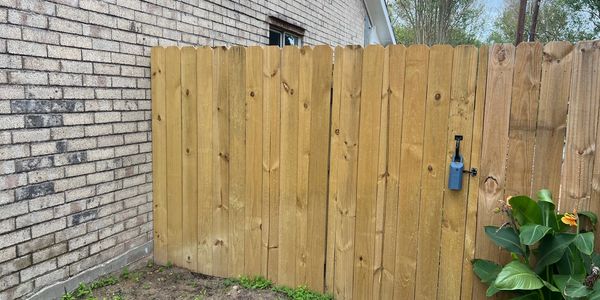 new wooden gate expertly installed, combining functionality and style. Features durable construction and a smooth finish for enhanced security and curb appeal. Perfect addition to residential fencing projects