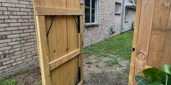 new wooden gate expertly installed, combining functionality and style. Features durable construction and a smooth finish for enhanced security and curb appeal. Perfect addition to residential fencing projects