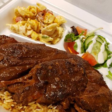 meat over rice with salad