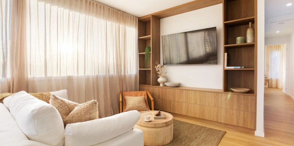 Bright and cozy living room with neutral tones and natural light.