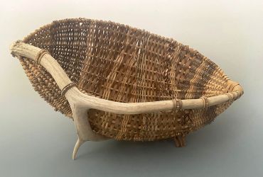 Handwoven basket with antler handles.