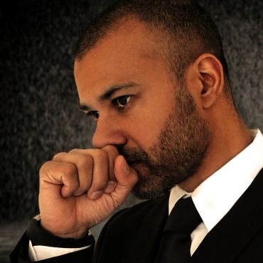 Pensive man in a suit.