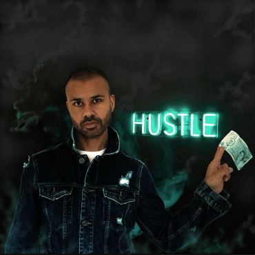 Man holding money with neon 'HUSTLE' sign.