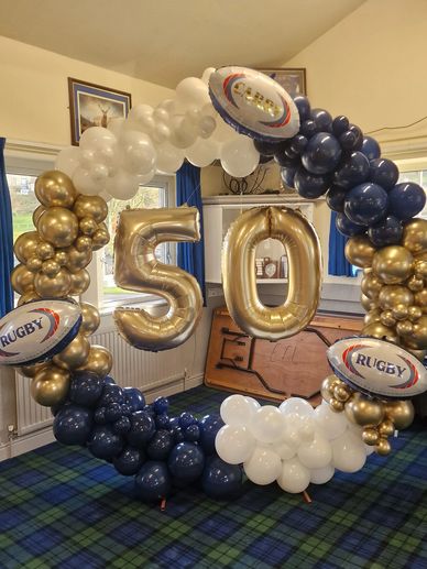 moongate hoop celebrating a 50th birthday with rugby balls 