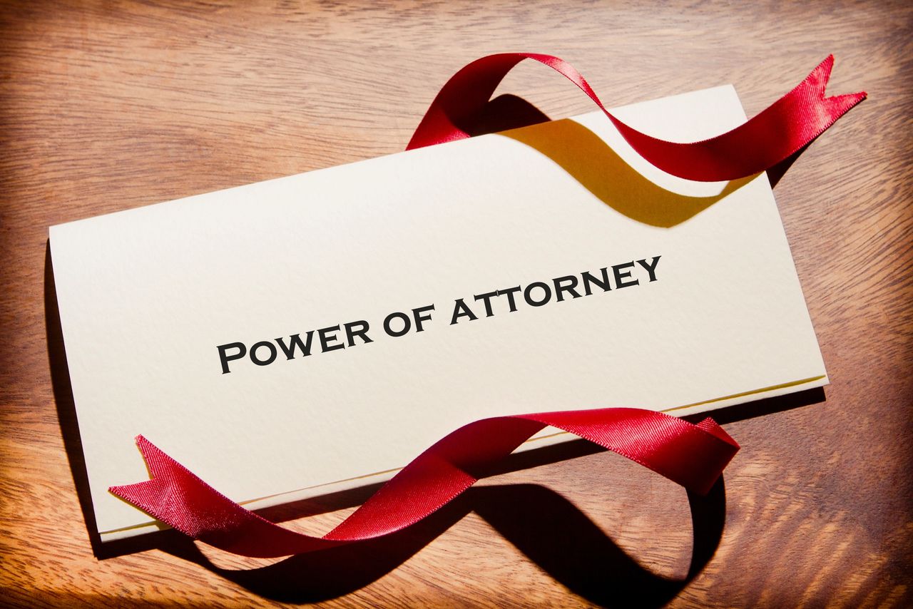 name card stating Power of Attorney name card stating Power of Attorney