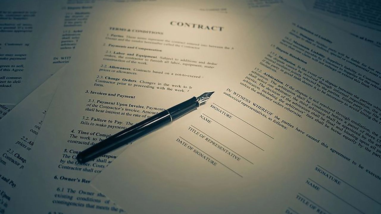 paper contract with pen