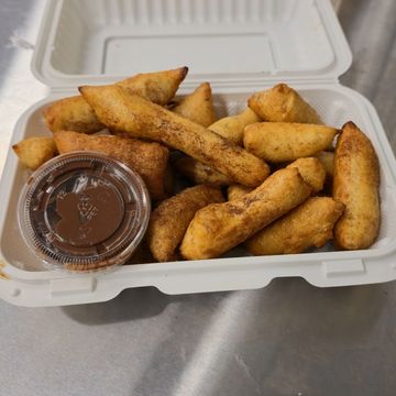 Warm, oven-baked cinnamon sticks with Nutella, the perfect dessert side with your pizza deals.