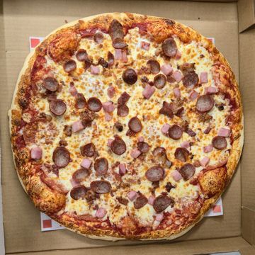 Meat Lover Pizza, pepperoni, crispy bacon, ham and italian sausage. Perfect for pickup or delivery.