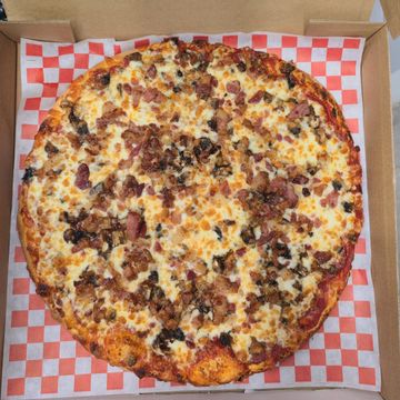 Canadian pizza with pepperoni, mushrooms, and crispy real bacon. Best pizza on Sargent Ave Winnipeg.