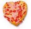 Heart-shaped pizza with toppings.