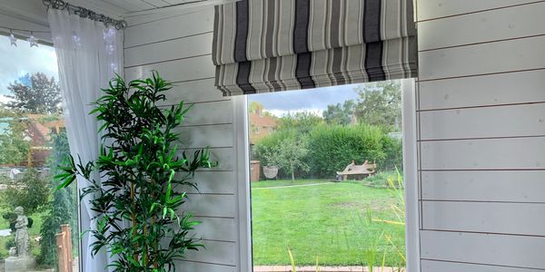Roman blind in summerhouse.