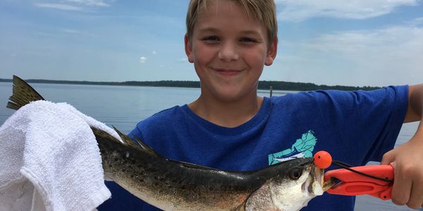 My son holding a Spotted sea trout 