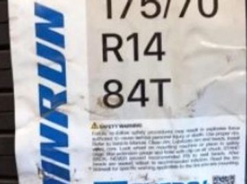 Tire label showing size and specifications.