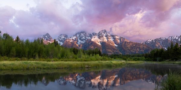 Mountain range reflected in a still river at dusk — fine art landscape print by Michael Bamber