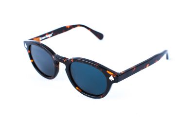 Tortoiseshell round sunglasses with dark lenses on white background.