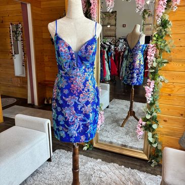 Blue floral dress on a mannequin.