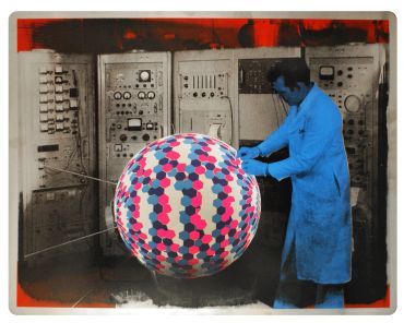 A scientist in a lab coat works with a colorful patterned sphere in a vintage laboratory.