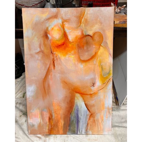 Three adults focused on drawing portraits on easels in an art class.