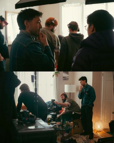 Film crew collaborates on set, adjusting camera and discussing shots.