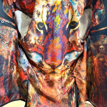 Vibrant jacket with a colorful, abstract tiger face design.
