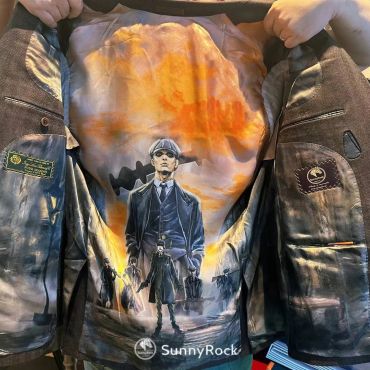 Inside jacket artwork featuring a character from Peaky Blinders with a smoky orange sky.