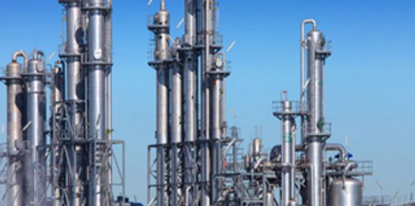 Picture of oil refinery against a blue sky background