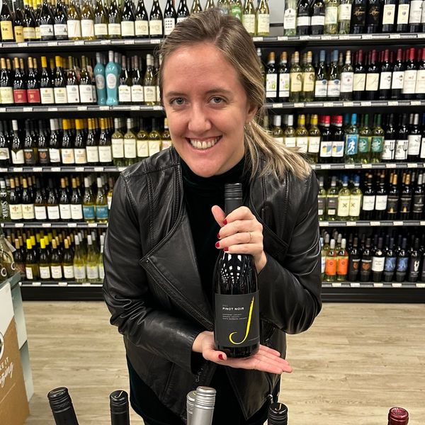 Emma Murray sampling wine in a Massachusetts liquor store.