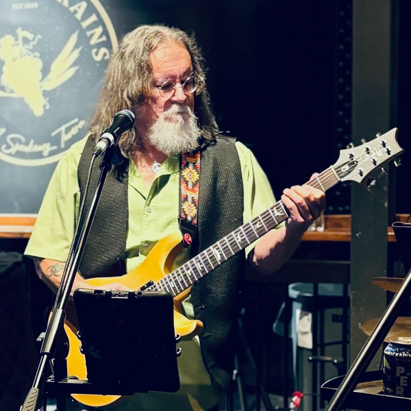 Eddie happily playing his guitar