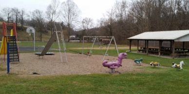 Paw Paw Youth Park  showing kids rides and pavillion.