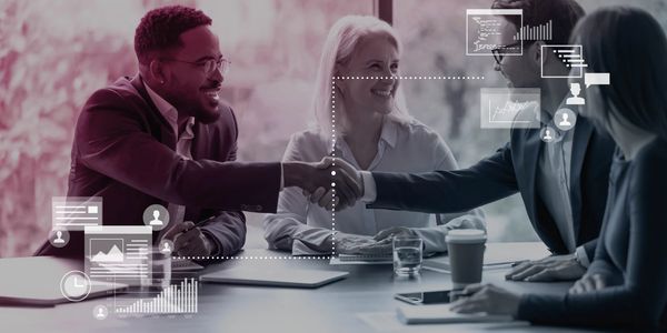 Two men shaking hands in a business meeting with digital data overlays.