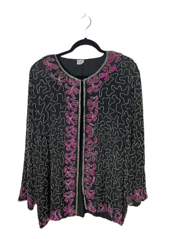 Black cardigan with pink floral embroidery and white swirl patterns.