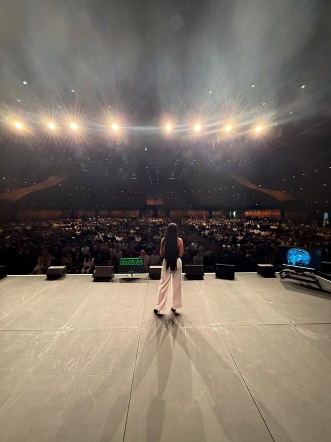 Krystelle Marie speaking on stage