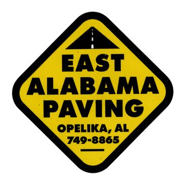 Yellow diamond-shaped sign for East Alabama Paving in Opelika, AL.