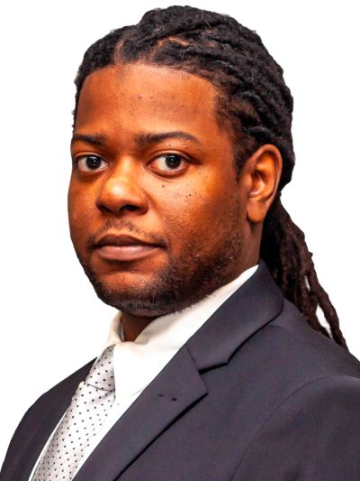 Professional man in suit with dreadlocks against white background.