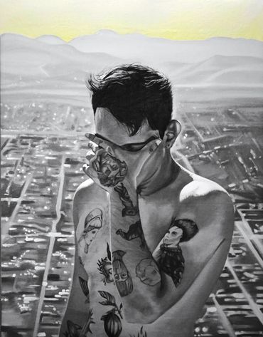 Black and white portrait of a tattooed man covering his face with his hand.