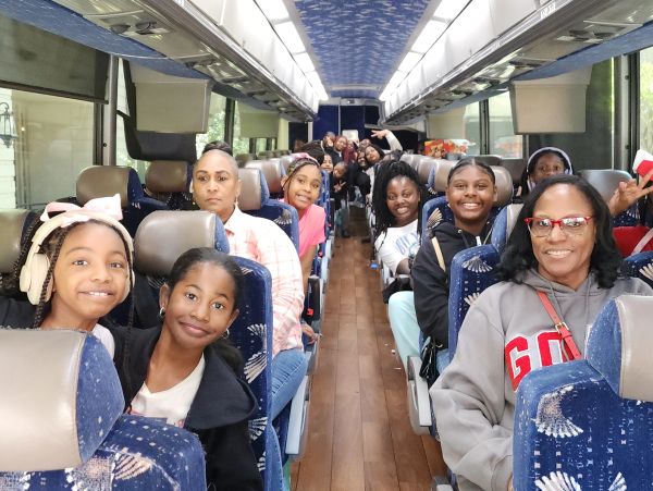 Group of happy people on a bus trip.