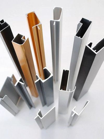 Various extruded aluminum profiles with different shapes and colors.