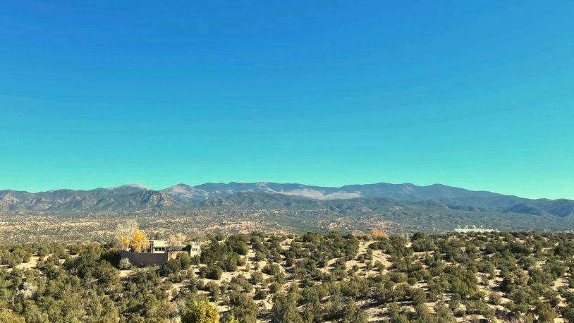 Santa Fe, NM Mountain desert view with blue clear sky, view of Santa Fe Opera House & Another house