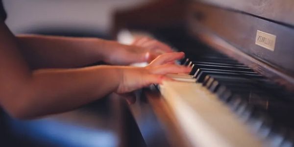small child playing piano