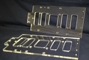 Machined Acrylic with 5 different cutouts many hole sizes and counterbores.