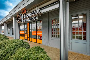 Exterior of G&amp;G Independent Insurance office with orange-themed signage.