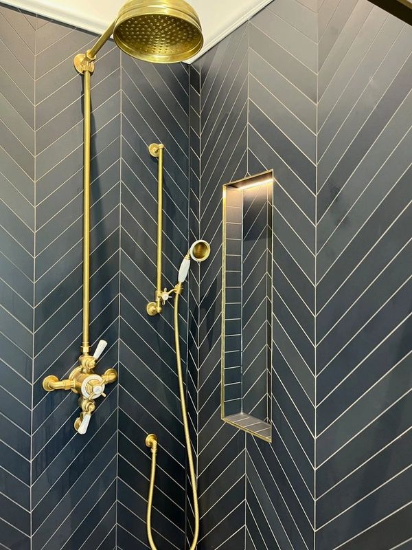 navy blue chevrons, lefroy brooks shower in brass, recess with led's light, brass trimed chevrons