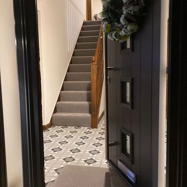 Entrance hallway new flooring and carpet on stairs 