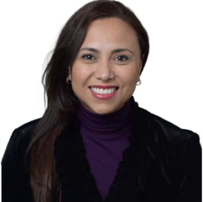 Smiling woman with long hair in a black jacket and purple turtleneck.