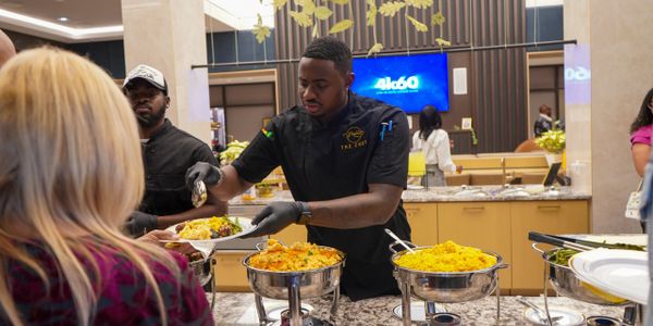 A scenic view of a mountain landscape at sunset with vibrant colors.