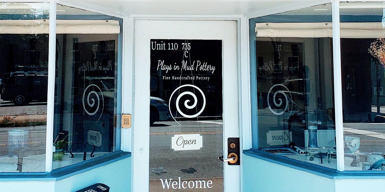 The front door of the Gallery at Plays in Mud Pottery located at 735C Haywood Rd. Asheville NC 28806