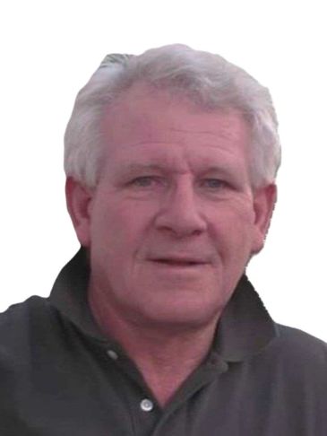 Portrait of an older man with gray hair in a dark shirt.