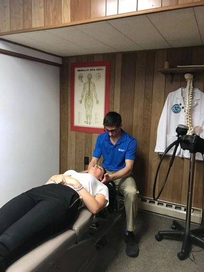 Dr Deimler doing manual neck adjustment